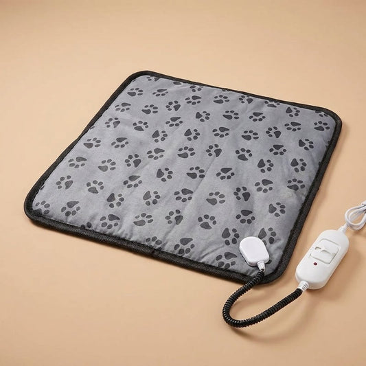 Grey paw-print cat heating pad with black trim, white cord and inline controller