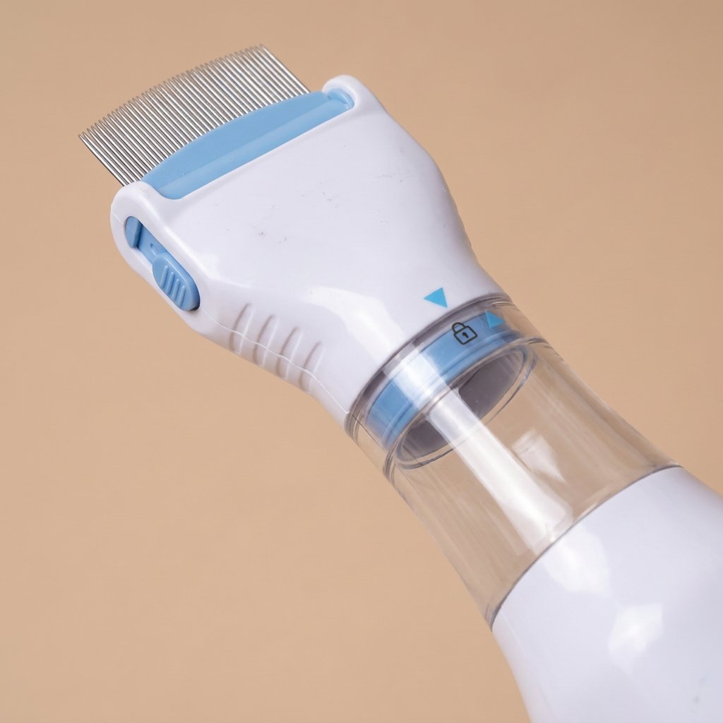 Electric flea comb detail angled view of metal comb teeth and lock arrow marking