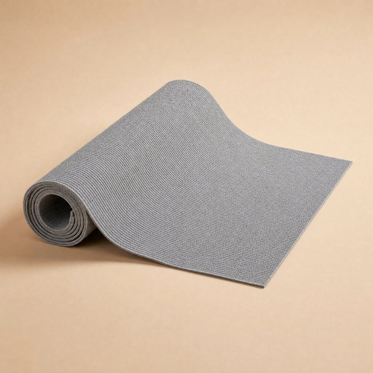 Grey anti-scratch sofa mat partially rolled to show flexible ribbed texture